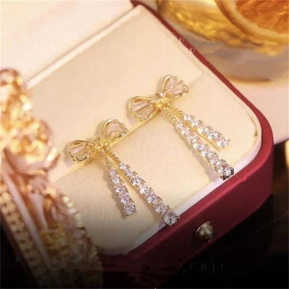 Elegant Silver-Plated Bowknot Earrings with Sparkling Cubic Zirconia Tassels - Ideal for Weddings and Gifts
